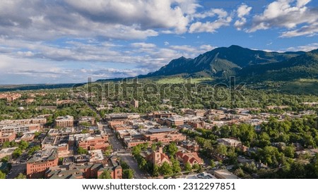 Aerial shot of downtown Boulder Colorado with beautiful flatirons in the background Royalty-Free Stock Photo #2312297851