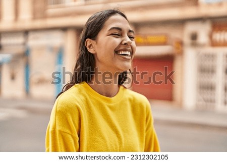 Young african american woman smiling confident standing at street