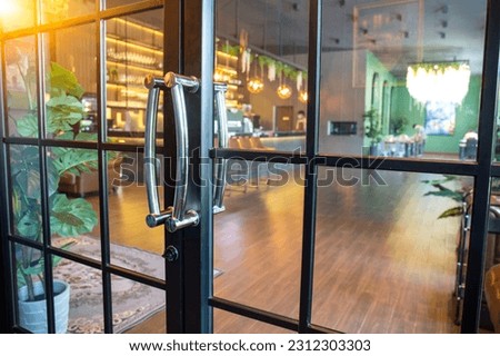 Glass door at the entrance of the coffee shop.
