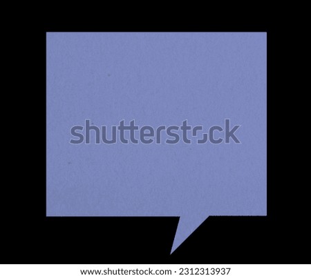 Purple paper chat bubble isolated on a black background. Blank speech bubble sticker.
