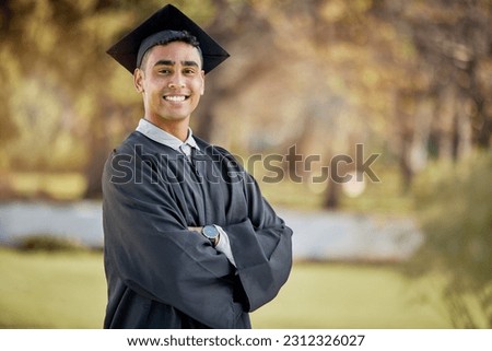 Portrait of happy man, graduation or student in university campus with degree, scholarship or education. Success, smile or male Indian graduate standing outdoors in college with school achievement Royalty-Free Stock Photo #2312326027