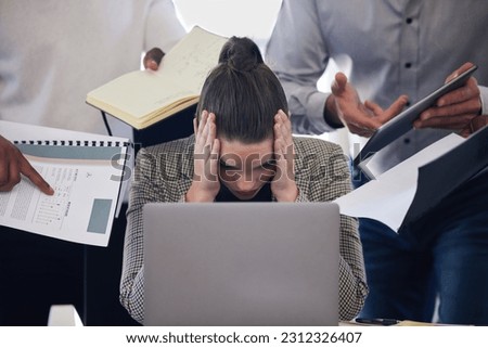 Laptop, headache and multitask with a business woman and demanding colleagues working in the office. Stress, anxiety and deadline pressure with an overwhelmed female employee at work on a computer Royalty-Free Stock Photo #2312326407