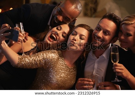Selfie, party and new year with friends in a club posing for photograph of celebration together. Champagne, toast and nightlife with a group of people taking a picture in a nightclub while dancing