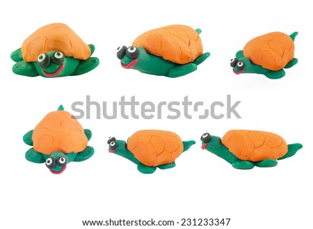 Set of yellow turtle made from plasticine on white background