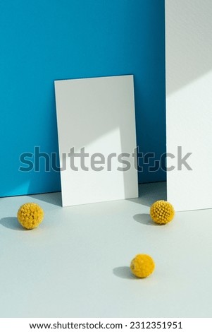 Blank white textured paper mockup on blue background