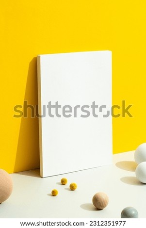 White blank magazine cover mockup on yellow and white background.