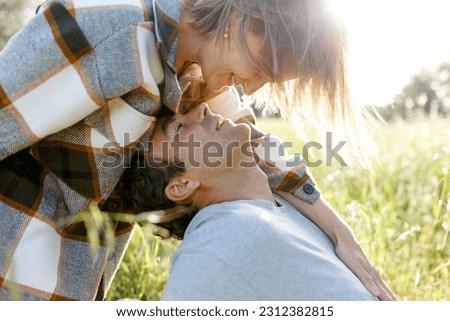 Close up portrait man and woman laughing together.Romantic affectionate couple on a holiday.Couple embracing and smiling. Sunset sunshine . Royalty-Free Stock Photo #2312382815