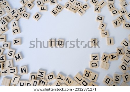 word IQ, wooden letters on wooden table, intelligence quotient on wooden background, quantitative indicator expressing success, concept of concept of level of mind, intellectual achievements
