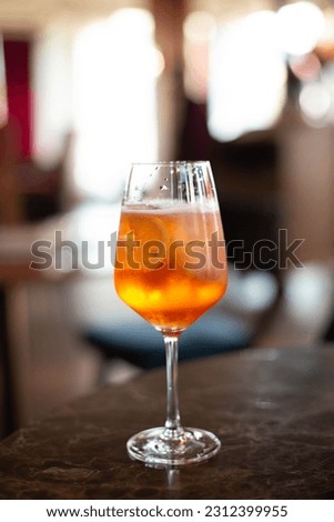 glass of aperol spritz cocktail on colorful background Royalty-Free Stock Photo #2312399955
