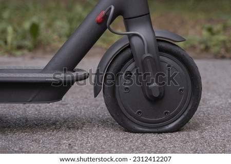 Close up picture of flat tire on electrical scooter. Problem with e-scooter. E-mobility. Problem with electrical mobility. Solid vs air tire. Airless vs pneumatic tire. 