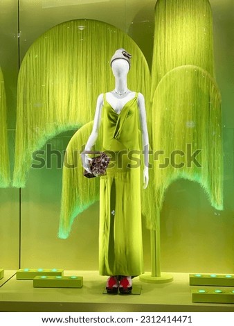 Female mannequin in fashion clothes in a shop 