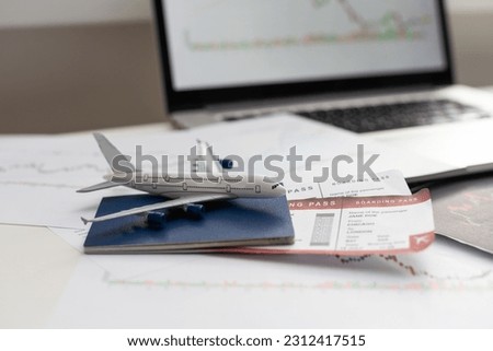 Airplane and money. Plane on the background of USA dollars. The cost of travel, air tickets and flights, financial expenses for vacation. Royalty-Free Stock Photo #2312417515