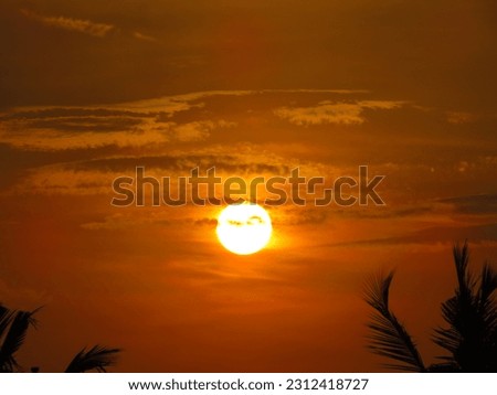 dusky view of the setting sun during sunset in the evening. Royalty-Free Stock Photo #2312418727