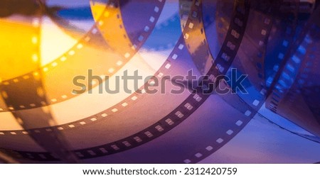 background with film strip.abstract colored background with film strip. Royalty-Free Stock Photo #2312420759