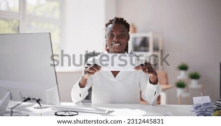 Holding Paycheck Or Payroll Check Or Insurance Cheque In Hand Royalty-Free Stock Photo #2312445831