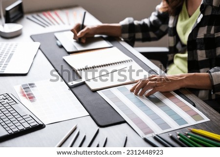 Graphic designer working with sketching logo design at office