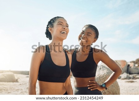 Fitness friends laughing at beach, women workout together with happiness and active lifestyle outdoor. Exercise in nature, healthy and happy with female people have funny conversation while training Royalty-Free Stock Photo #2312454249