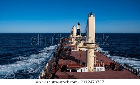 handy size bulk carrier under way in the sea