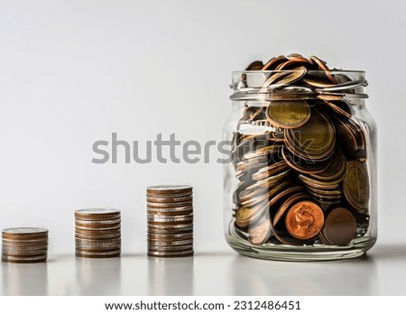 Free photo jar with money savings growth up and coins stack on table concept 