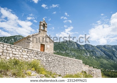 St Sava Church pictured up the side of a mountain on the coastline in Montenegro taken in May 2023.