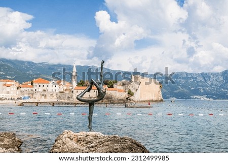 The Budva ballerina statue pictured on the top of a rock in front of the Budva old town in May 2023.  Created by Gradimir Aleksic, the iconic sculpture can be seen on most postcards of the town.