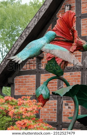 Hummingbird sculpture in Vogelpark Walsrode. High quality photo