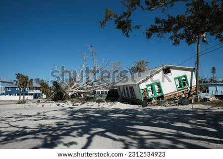Destroyed Houses and Uprooted Trees after Hurricane Ian in Fort Myers Florida Sea Front, USA Royalty-Free Stock Photo #2312534923