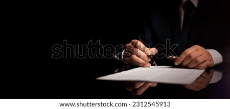 Notary public or attorney in office signing document Royalty-Free Stock Photo #2312545913