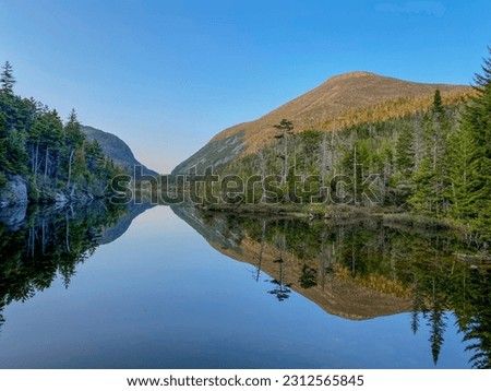 Mirrored picture of Mt Colden in the lake below during an off the grid backpacking trip in the Adirondack Mountains.