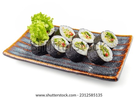 Japanese food. Sushi roll on a plate isolated on white background. Roll with avocado and vegetable. Sushi roll with avocado, seaweed, cucumber, rice and nori isolated on white.