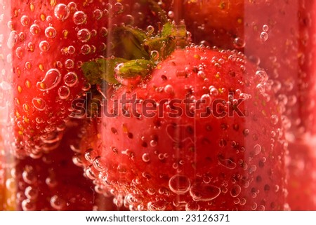 Close up picture of strawberries in glass with water