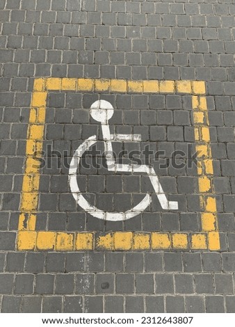 Wheelchair sign on road surface
