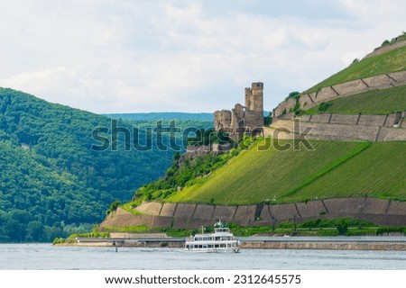 Ship on River Rhine with Ehrenfels Castle of Ruedesheim Germany Royalty-Free Stock Photo #2312645575