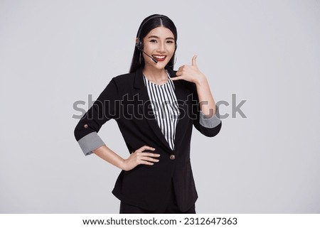 Happy young asian business woman call center. Welcome female operator put on smalltalk headphone standing on isolated white background.