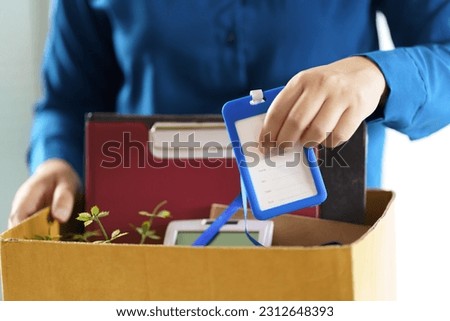 Quit Job Business man sending resignation letter and packing Stuff Resign Depress or carrying business cardboard box in office. Change of job or fired from company