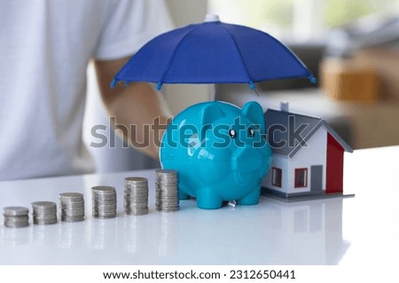 Protection, pile of coins and mockup house with umbrella hand holding on white background, financial insurance and safe investment concept Royalty-Free Stock Photo #2312650441
