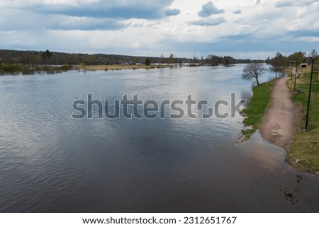 The Vasterdal river overflows its banks at the spring flood, picture from the center of Malung in Dalarna County, Sweden.