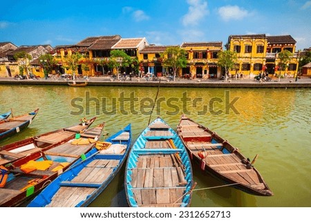 Fishing boats at the riverfront of Hoi An ancient town in Quang Nam Province of Vietnam Royalty-Free Stock Photo #2312652713