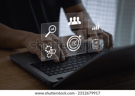 Target customer, targeting the business concept, Businessman use laptop with digital marketing icons on virtual screen, Business goal, Digital marketing, online business, Set goals for better results. Royalty-Free Stock Photo #2312679917