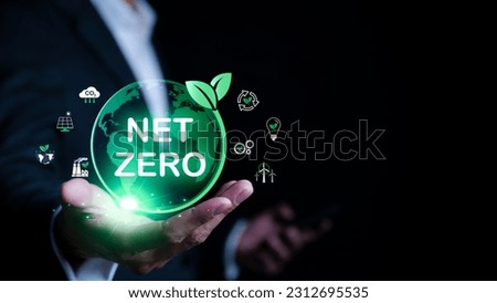 In hands of businessmen there is virtual globe with Net Zero icon. Climate neutral long term strategy. Decarbonization sustainability, greenhouse gas emissions target, reduce carbon footprint, Royalty-Free Stock Photo #2312695535
