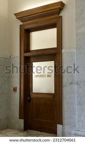 Municipal building interior transom door for Employees Only
