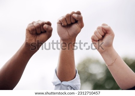 Anger, justice and fists of people at a protest for freedom, government change and fighting power. Angry, support and diversity and community with passion for social movement, politics and solidarity Royalty-Free Stock Photo #2312710457