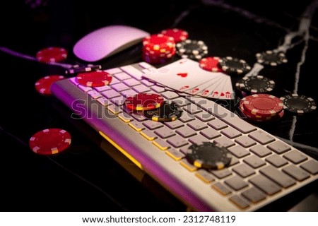 Online Gambling. Online Casino. Poker chips lie on the keyboard. Poker online. Internet. Royalty-Free Stock Photo #2312748119