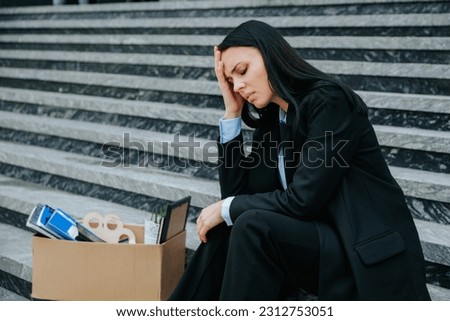 A somber image of a woman sitting on stairs, lost in thought about her lost job and worklessness. Jobless and Alone A Woman Sitting on Steps with a Sad Expression