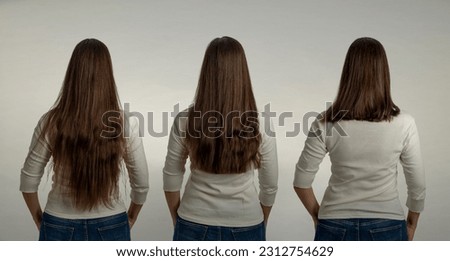 The phases of a haircut - before, during, after - the same woman in a white shirt and jeans - with hair of different lengths - medium length, mid-back and waist length. Back view. Royalty-Free Stock Photo #2312754629