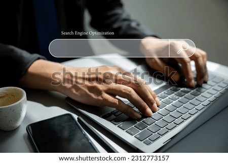 Using a blank search bar, a businessman is browsing the internet and searching for information on his laptop. This stock photo portrays the concept of search engine optimization and networking.