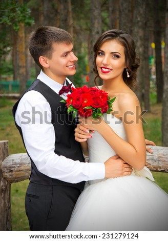 Newlyweds at the summer forest