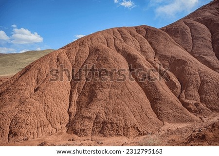 Beautiful view of cliffs from yellow red limestone. Konochek, Kyrgyzstan.