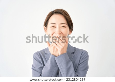 Surprised Asian businesswoman in white background