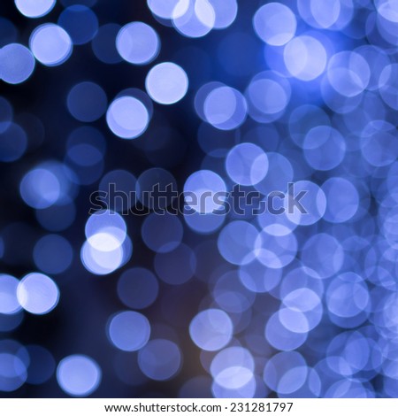 Blue Festive Christmas background with bokeh lights and stars